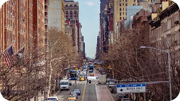 Busy city street filled with vans and delivery vehicles