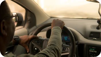 NEMT driver behind the wheel of a transport vehicle